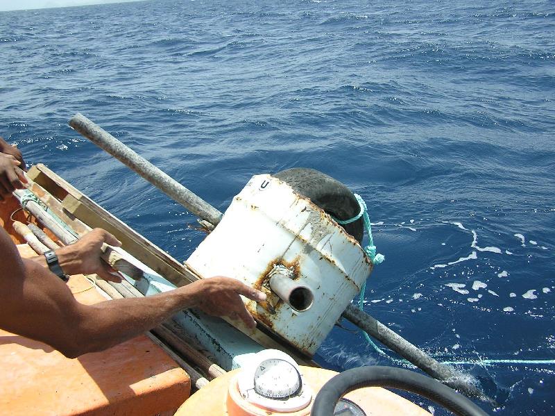 Step 5 - deploying the FAD anchor (built with cement in a half barrel and pipes. - photo by GGerman